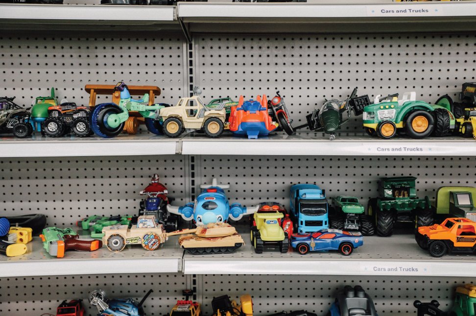 secondhand toys organized on shelf